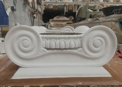 Ionic capital being worked on in the workshop